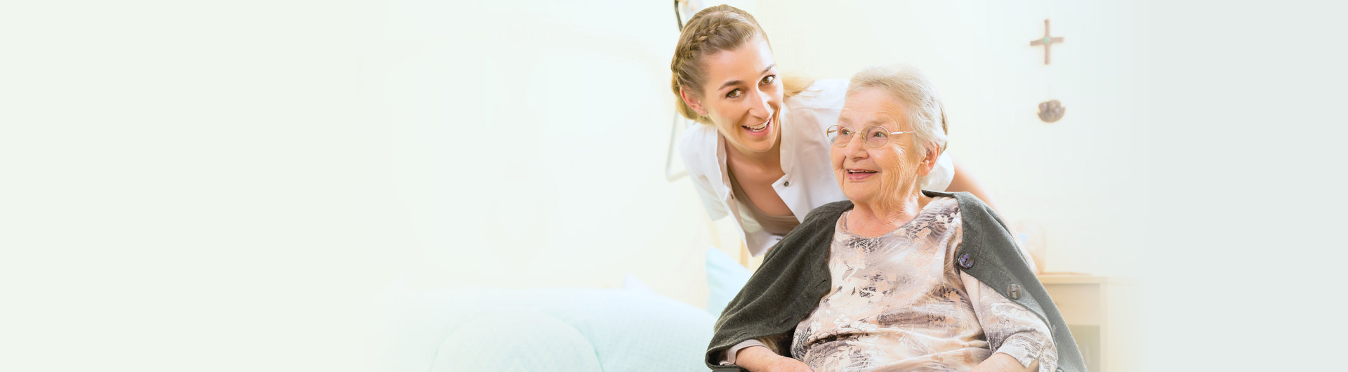 happy elderly woman with her caregiver